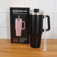 Lifestyle image with black insulated travel mug and coffee