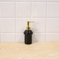 Decorative black glass soap dispenser for modern bathrooms