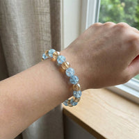 Angle view of stylish dual-tone beaded stretch bracelet