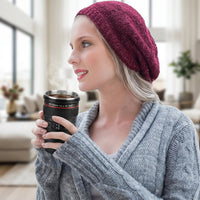 Camera lens coffee mug with its lid off, revealing the stainless steel interior.
