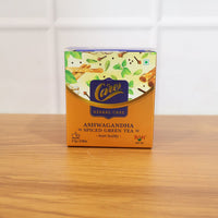 Lifestyle image of brewing ashwagandha spiced green tea herbal infusion