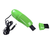 Close-up of the USB mini vacuum cleaner with its nozzle attachment.
