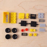 Interactive bulldozer pencil sharpener toy for kids' desk