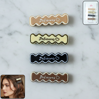 Set of four elegant design hair clips with wavy text patterns