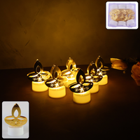 Golden diya shaped LED tealight candle glowing warmly