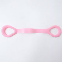 Woman using resistance band for arm exercises during workout