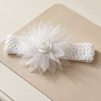 Close-up of floral bow on the soft stretchable baby headband