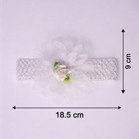 Close-up of colorful floral baby headband made from elastic fabric