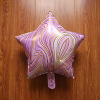 Front view of star marble foil balloon