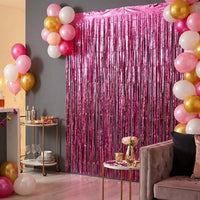 Foil fringe curtain enhancing festive atmosphere at a home party.