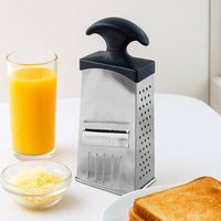 Stainless steel 4-in-1 grater and slicer with ergonomic handle for kitchen use