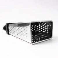 Fine and coarse grater surfaces of stainless steel 4-in-1 grater with handle