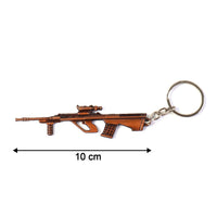 Decorative gun-shaped metal keychain in vintage style