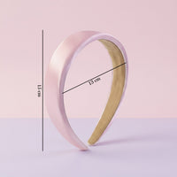 Detail shot emphasizing smooth satin finish of the padded hairband