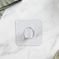 Hook attached on glass surface for versatile hanging