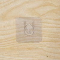 Wall hook on wooden door with transparent adhesive
