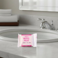 Close-up image showing shampoo sachet and bath soap in the toiletry kit