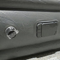 Portable inflatable bed partially folded illustrating compact and lightweight design