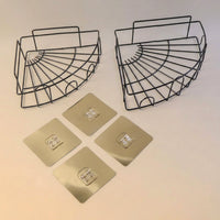 Decorative iron shower caddy corner enhancing a modern home interior with stylish storage.