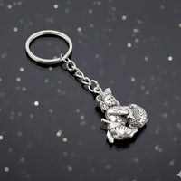 Side profile of Bal Krishna Makhan Chor silver metal keychain