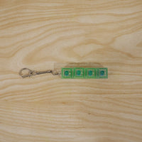 Small gadget key holder with tactile click and LED glow