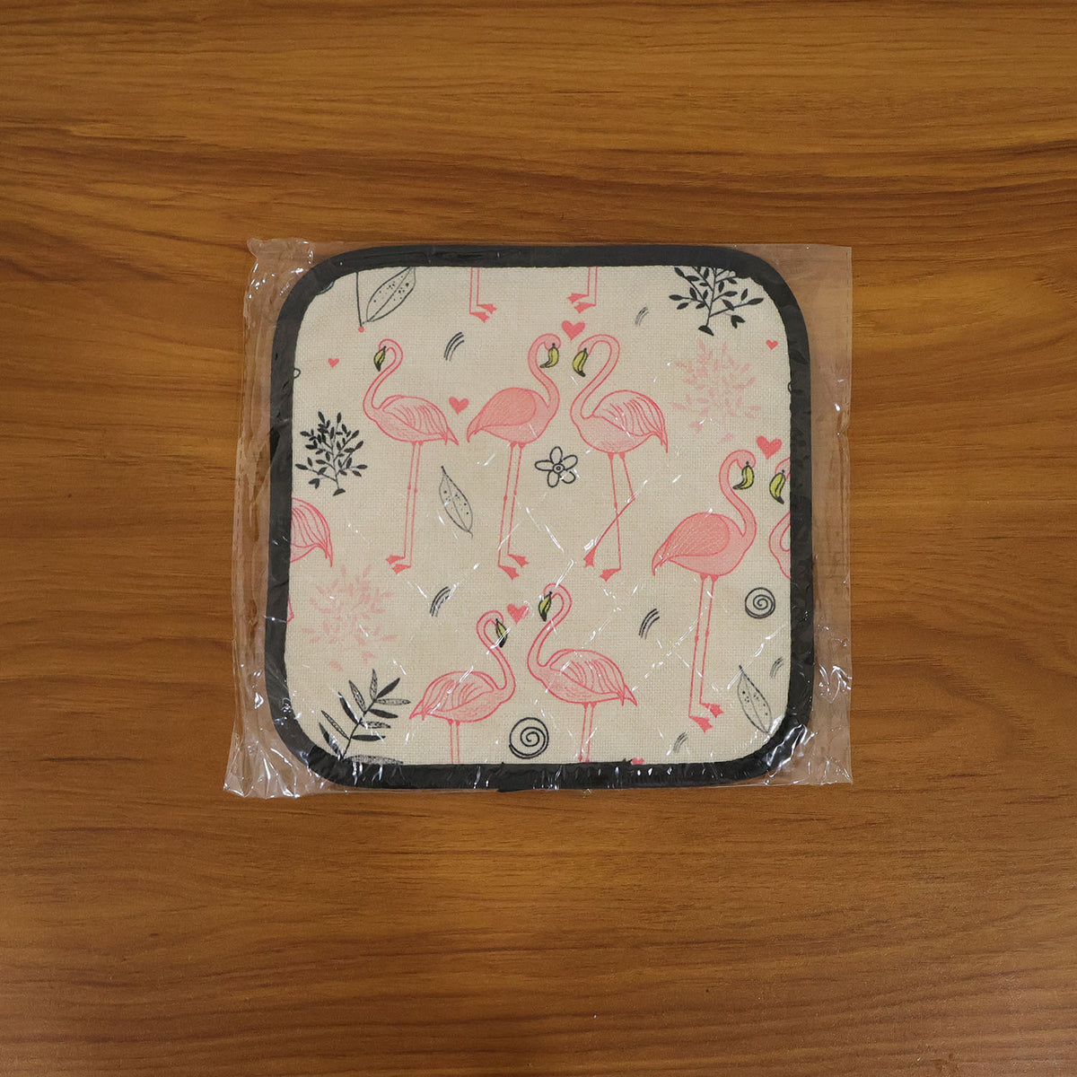 Printed heat resistant kitchen pot holder mat actively used in kitchen