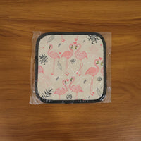 Printed heat resistant kitchen pot holder mat actively used in kitchen