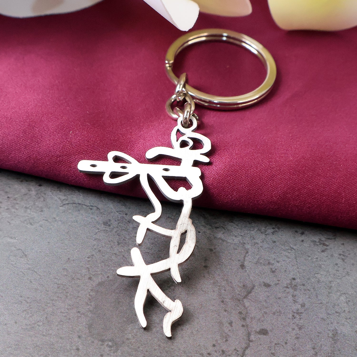 Krishna flute design stainless steel keychain with spiritual motif