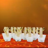 Close-up of decorative cactus LED tealight candle with warm glow