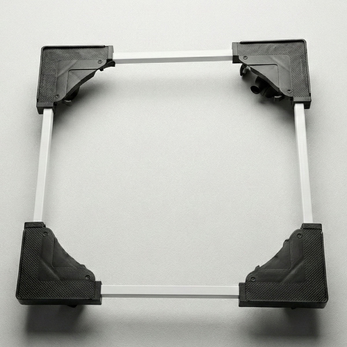 Adjustable appliance stand elevating a washing machine in a laundry area