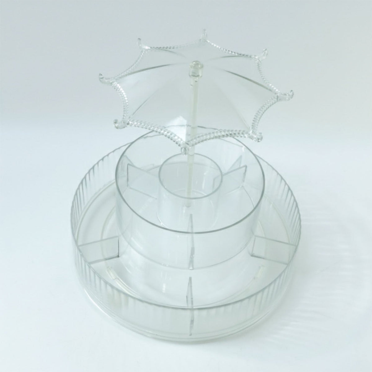 Spinning makeup and jewellery holder