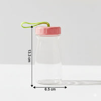 Close-up view of glass bottle topped with leak-proof silicone lid