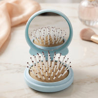 Space saving folding brush with mirror for men and women