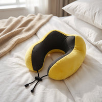Bright yellow travel pillow for head and neck support