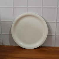 Lightweight and sturdy round serving plate for diverse kitchen needs