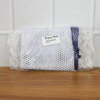 Ironing mesh press cloth safeguarding delicate patterned garment during ironing