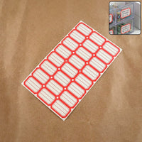 Sheet of red and white self-adhesive rectangular label stickers arranged neatly