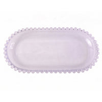 Transparent oval glass tray for serving snacks and sweets