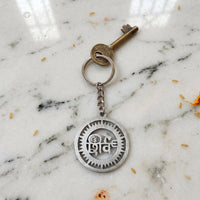 Metal Shiv keychain showcased with keys