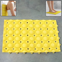 Close-up of suction cups beneath anti-slip bathroom massage mat