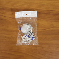Skeleton doll keychain displayed as quirky bag charm
