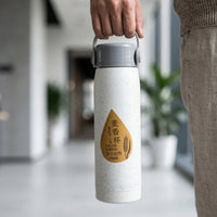 Ergonomic design of glass water bottle with phone stand