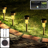 Ground stakes of solar lawn lamps set of 12 lighting up lawn area at dusk