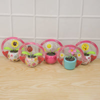 Fun solar powered flower pot toy that dances with light