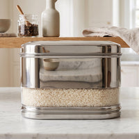 Side view of stainless steel modular oval canister in kitchen