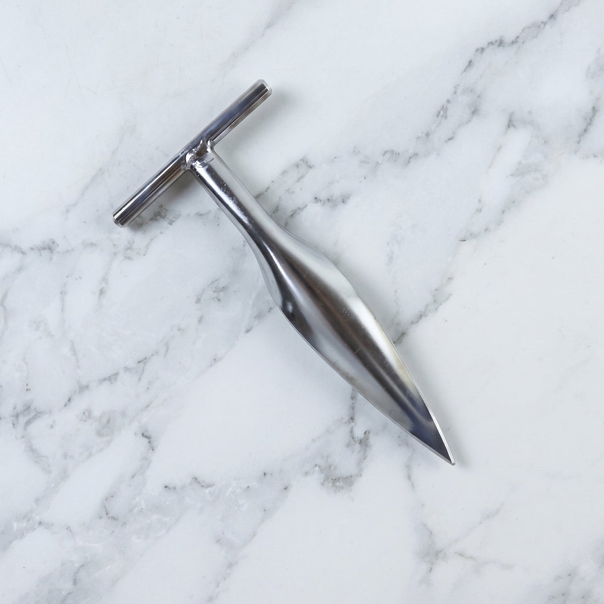 Stainless steel coconut breaker tool set displayed on a white background