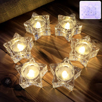 Set of 6 star-shaped flameless LED candles providing warm light