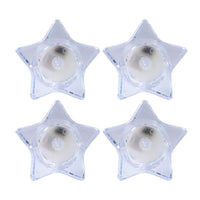Flameless LED candles shaped like stars providing ambient light