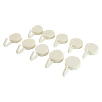 Adhesive round wall hooks organizing kitchen tools effectively