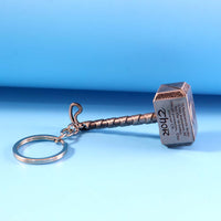Metal hammer keychain with sturdy metal ring holding keys